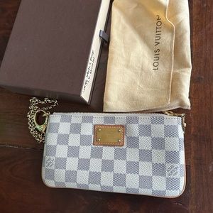 Authentic Cream-colored Louis Vuitton wristlet.